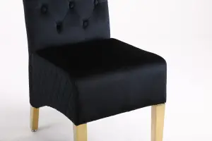 A Pair of Velvet Dining Chairs with Golden Legs in Black