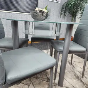 Round Glass Grey Kitchen Dining Table With Storage Shelf And 4 Grey Metal Chairs Set