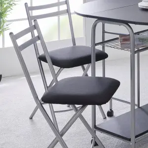 Greenhurst Stowaway Dining Set, Black Drop Down Table with Silver Frame, Four Folding Chairs Stack Underneath, Compact Footprint