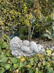 Vintage Cherub Statue Laying on a Grape