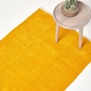 Homescapes Mustard 100% Cotton Plain Chenille Rug with Natural Trim, 45 x 70 cm