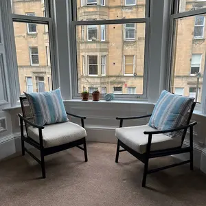 Borneo Rattan Accent Chair Indoor Black with Boucle Cushion