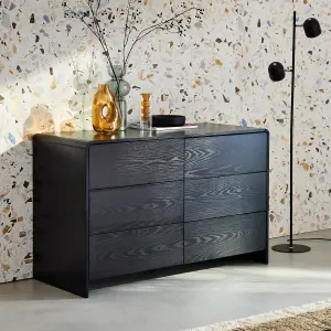 sweeek. 6-drawer rounded wood-effect chest Milo Black 120x50x75 cm