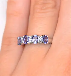 Tanzanite 0.76Ct And Diamond 9K White Gold Ring