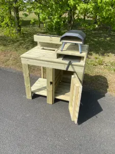 outdoor pizza oven table with built in cupboard storage, raised pizza stand and planter top