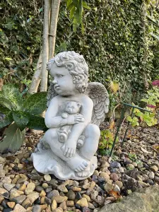 Stone Cast Cherub Ornament with Teddy on Hand