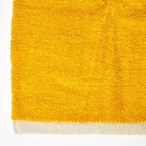 Homescapes Mustard 100% Cotton Plain Chenille Rug with Natural Trim, 110 x 170 cm