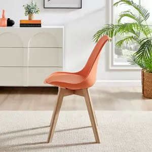 Furniturebox Seattle Scandi Inspired Glass and White Leg Square Dining Table & 4 Orange Cushioned Stockholm Beech Wood Leg Chairs