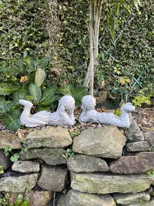 Cheerful Laying Boy and Girl Outdoor Ornament