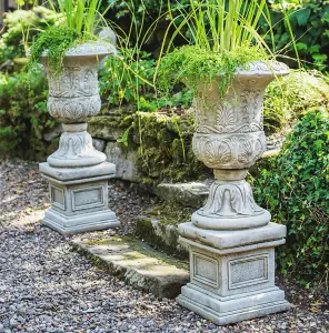 Pair of Large Victorian Stone Cast Urns with Plinths