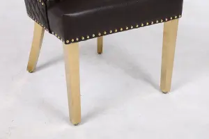 A Pair of Leather Aire Dining Chairs with Golden Legs in Black