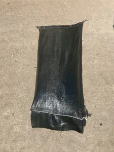 20 Filled black polyproplene sandbags