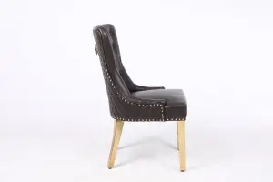 A Pair of Leather Aire Dining Chairs with Golden Legs in Black