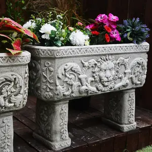 Pair of Lion design Stone Troughs on legs