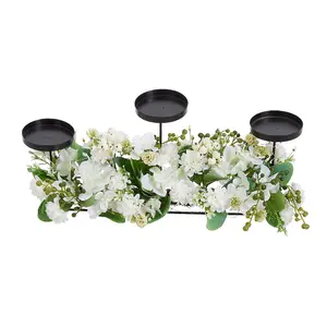 Wedding Decor Candlesticks with Faux Flowers and Warm Light