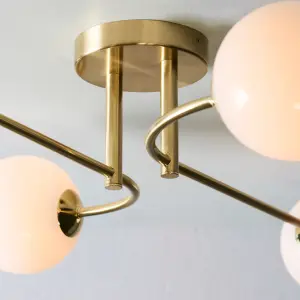 Anson Lighting Consort 4lt Semi Flush light finished in Satin brass plate and opal glass