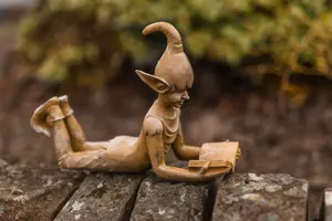 Laying Elf Reading Garden Ornament