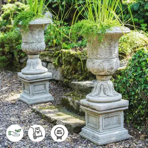 Pair of Large Victorian Stone Cast Urns with Plinths