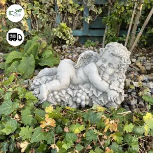 Vintage Cherub Statue Laying on a Grape