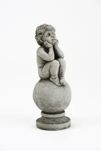 Adorable Stone Cast Boy on Ball Statue