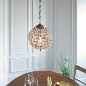 Anson Lighting Lily Pendant light finished in Antique brass plate and clear glass