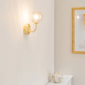 ValueLights Chessy Pair of - Gold Metal Curved Wall Light with Amber Ribbed Glass Globe Shade - LED Bulbs Included