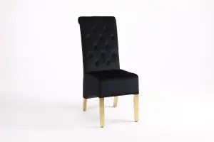 A Pair of Velvet Dining Chairs with Golden Legs in Black