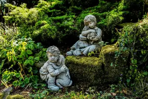 Sweet Boys Statues with Cat and Puppy in hands