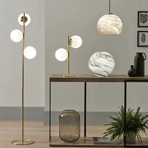 White Orb and Gold Metal Floor Lamp