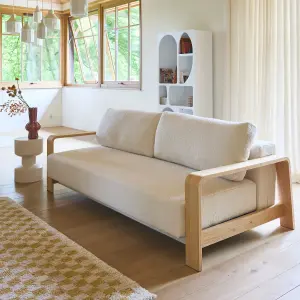 sweeek. 3-seater sofa bed in white boucle with wooden armrests Eden White 224x108x85 cm