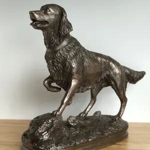 Golden Retriever on Rocks dog figurine in solid cold cast bronze