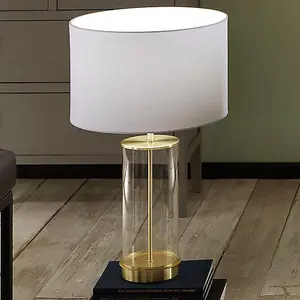 Clear Glass and Champagne Metal Table Lamp with  Ivory Poly Cotton Cylinder Drum Shade