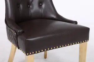 A Pair of Leather Aire Dining Chairs with Golden Legs in Black