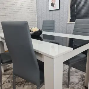 Modern White and Black Wood Dining Table With 4 Grey Chairs