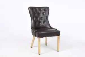 A Pair of Leather Aire Dining Chairs with Golden Legs in Black