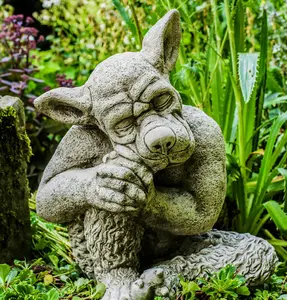 Solid cast Stone Dog Gargoyle In Sleepy Pose