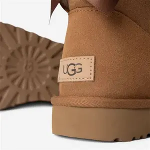 UGG® Mini Bailey Bow II Boot For Women In Brown, Size 9, Suede