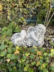 Vintage Cherub Statue Laying on a Grape