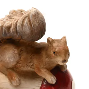 Country Living Squirrel Tipping a Mushroom Over Ornament