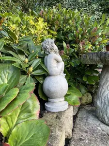 Adorable Stone Cast Boy on Ball Statue