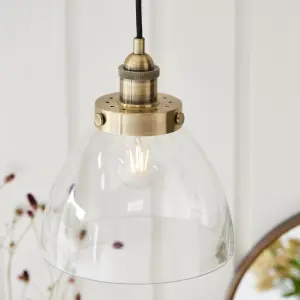 Anson Lighting Pampa Pendant light finished in Antique brass plate and clear glass