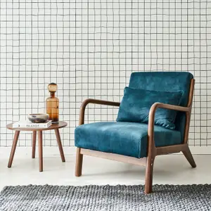 sweeek. Scandi-style armchair in velvet and light walnut-stained hevea wood Lorens velvet Petrol Blue 65x80x79 cm