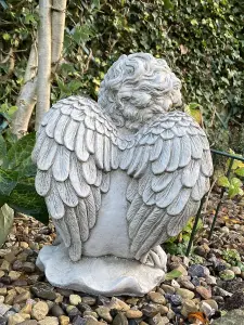 Stone Cast Cherub Ornament with Teddy on Hand