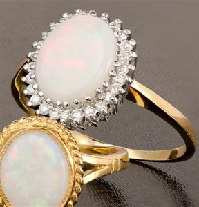 Opal 10 X 8mm And Diamond 9K Yellow Gold Ring