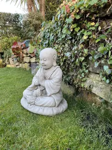 Small Monk on a cushion Garden Ornament