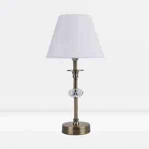 First Choice Lighting Antique Brass Plated Stacked Bedside Table Light with Faceted Acrylic Detailing and White Fabric Shade