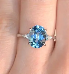 9K White Gold Diamond And 2.60Ct Blue Topaz Ring