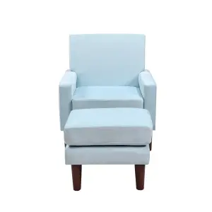 Plush velvet chair with footstool in blue