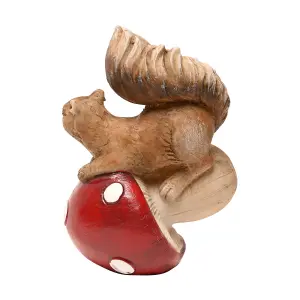 Country Living Squirrel Tipping a Mushroom Over Ornament