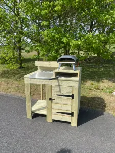 outdoor pizza oven table with built in cupboard storage, raised pizza stand and planter top